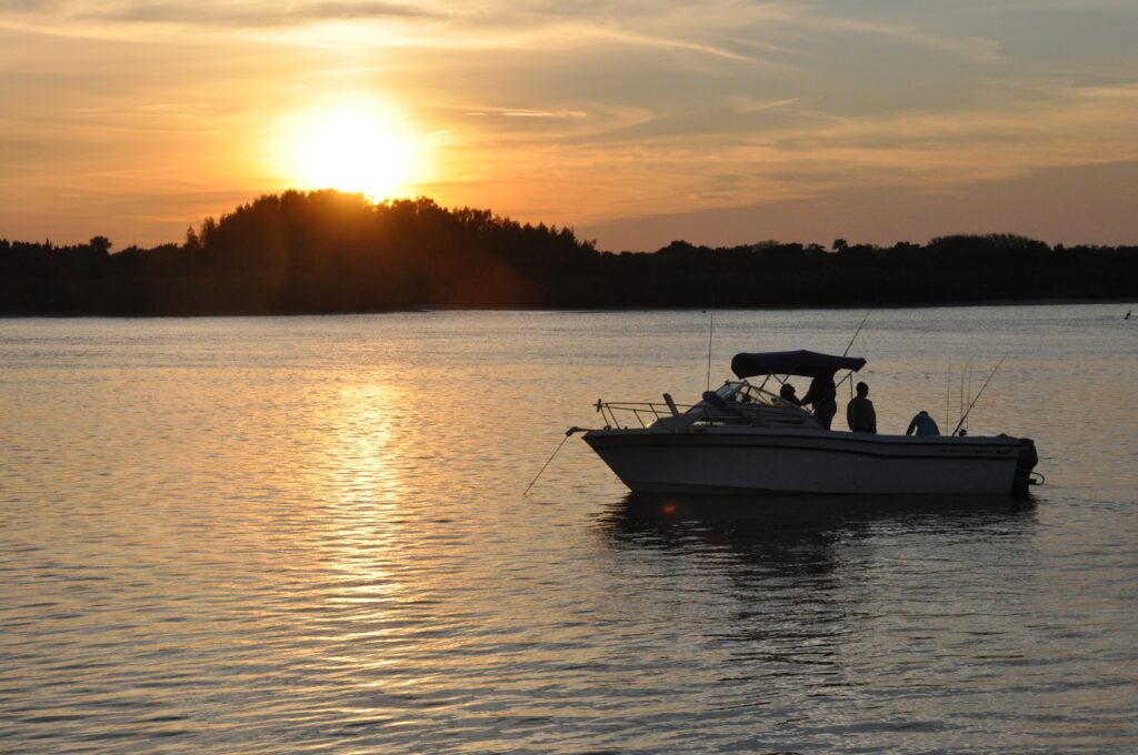 A Boat And Silhouettes In The Water In The Ocean 2026 03 09 05 22 37 Utc 1024x680